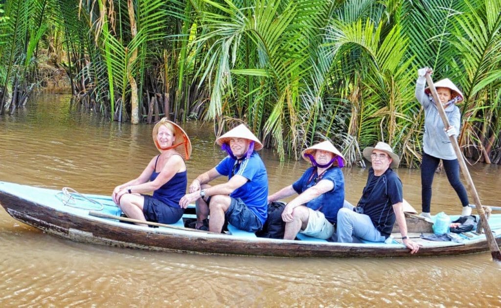 sampan boat along the super small canal in Mekong Delta