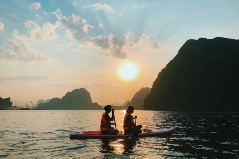 Experience the stunning sunset while kayaking on the crystal-clear waters.